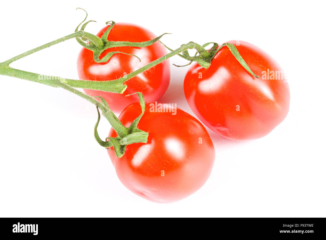 cherry tomatoes isolated on a white background Stock Photo - Alamy