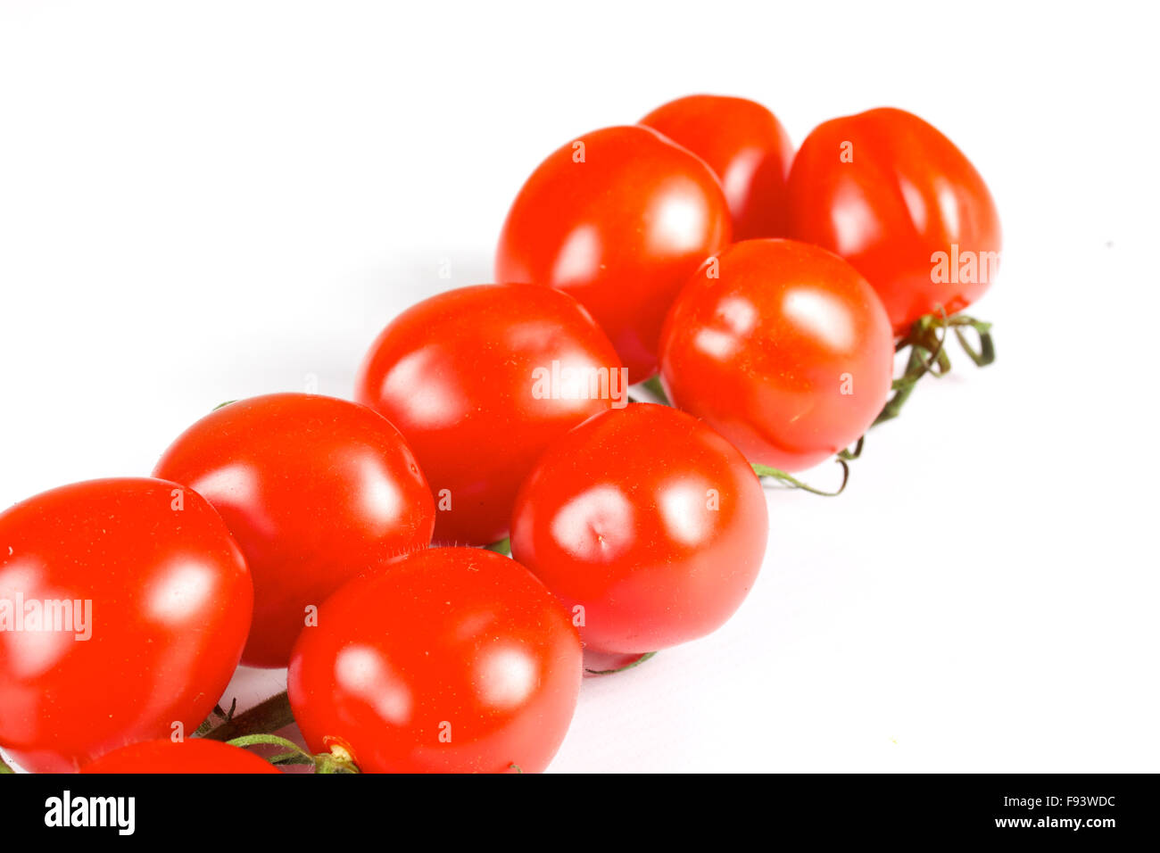 cherry tomatoes isolated on a white background Stock Photo - Alamy