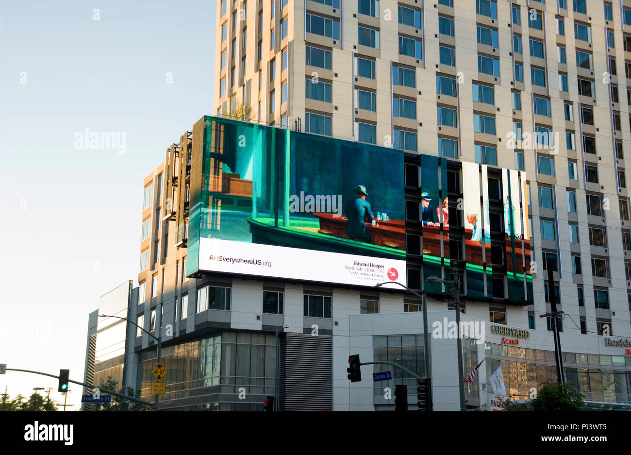 An Edward Hopper painting is reproduced on a digital outdoor advertising panel in Downtown Los Angeles during the Art Everywhere event . Stock Photo