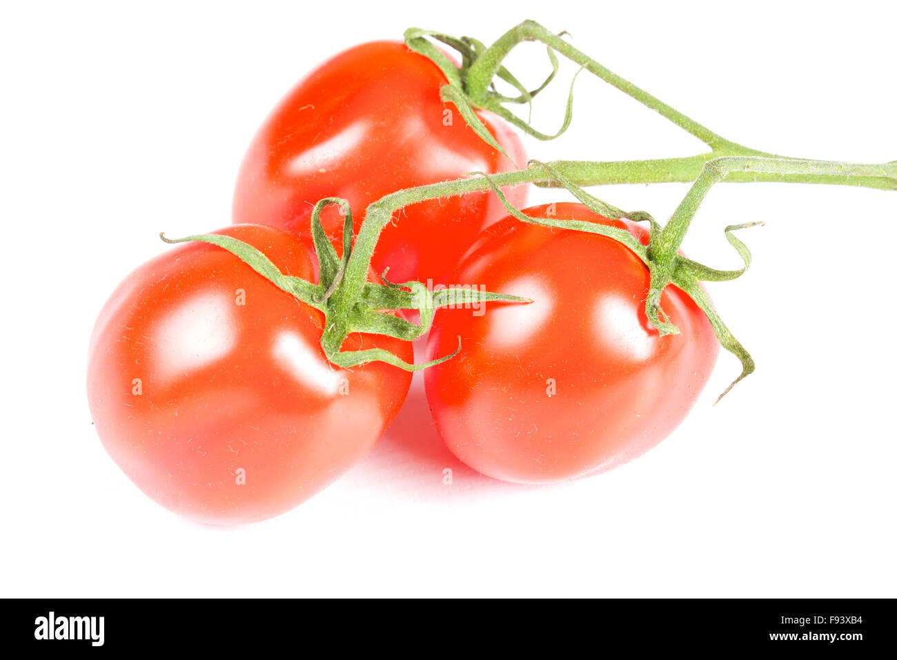 cherry tomatoes isolated on a white background Stock Photo - Alamy