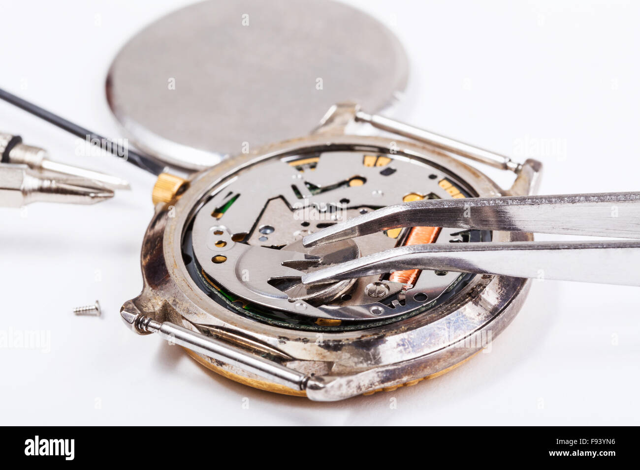 Repairing of watch - replacing battery in quartz watch close up