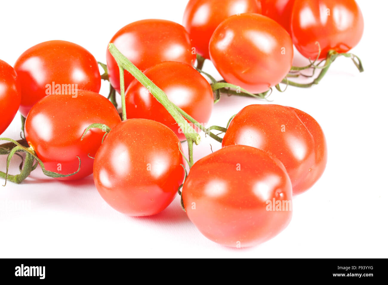 cherry tomatoes isolated on a white background Stock Photo - Alamy