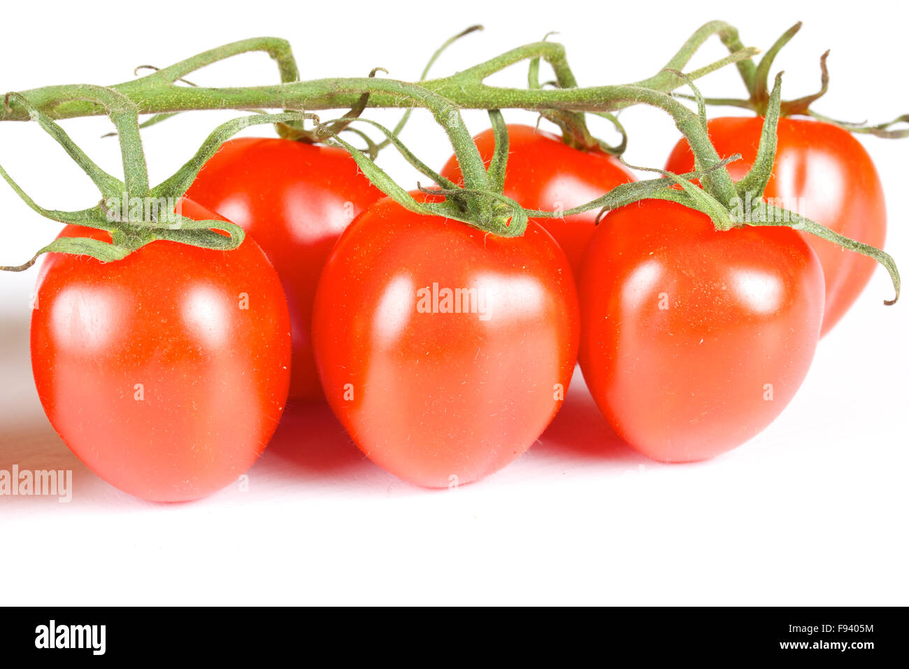 cherry tomatoes isolated on a white background Stock Photo - Alamy