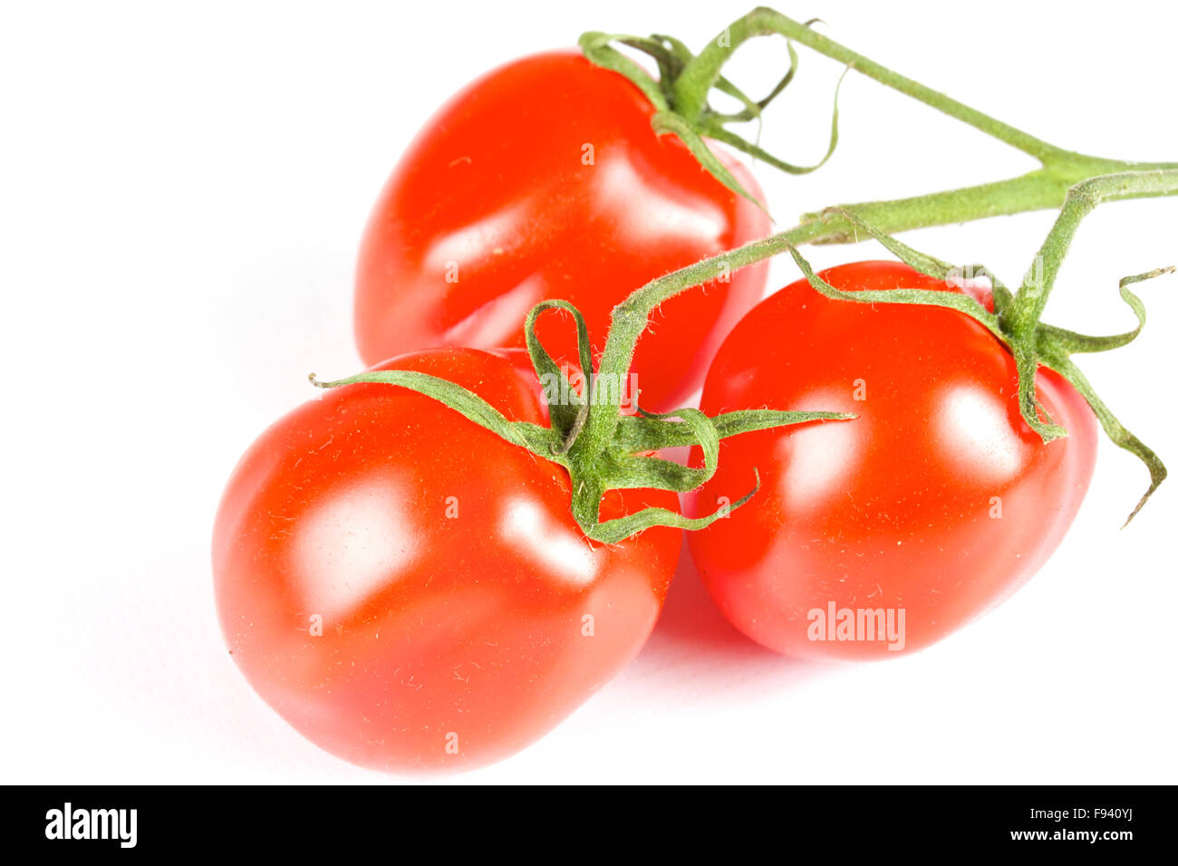 cherry tomatoes isolated on a white background Stock Photo - Alamy