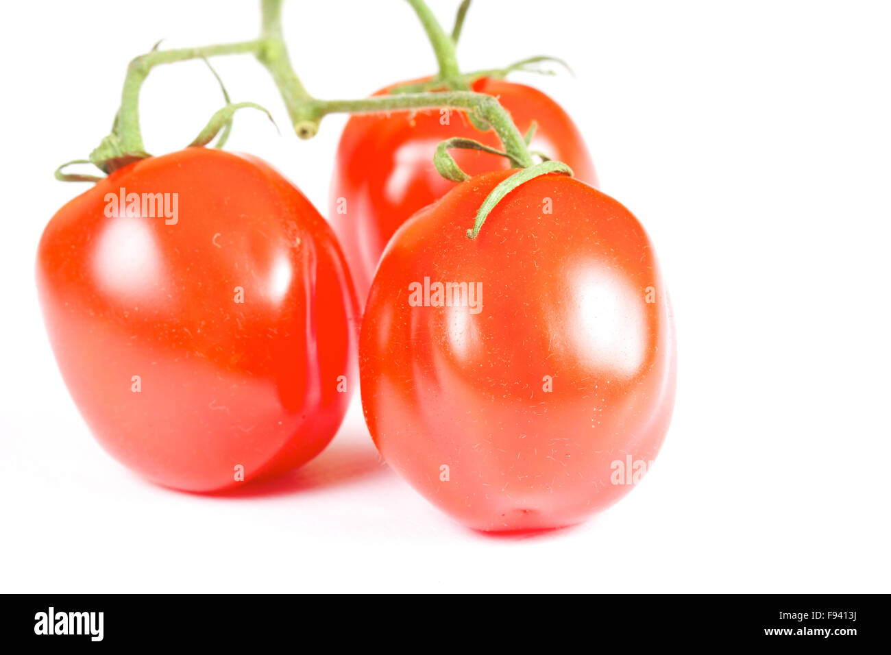 cherry tomatoes isolated on a white background Stock Photo - Alamy