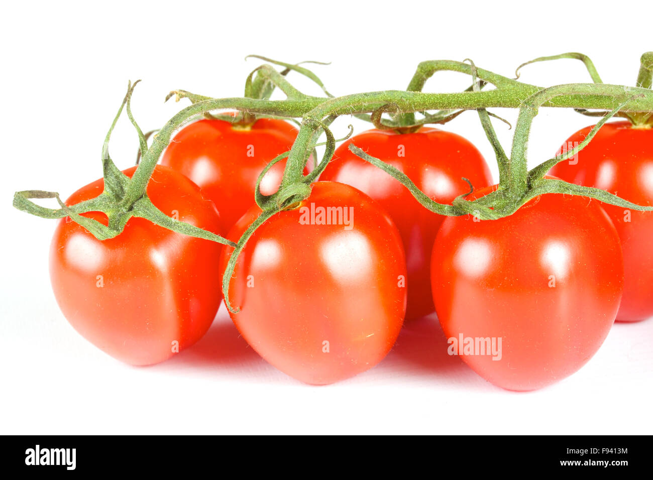 cherry tomatoes isolated on a white background Stock Photo - Alamy