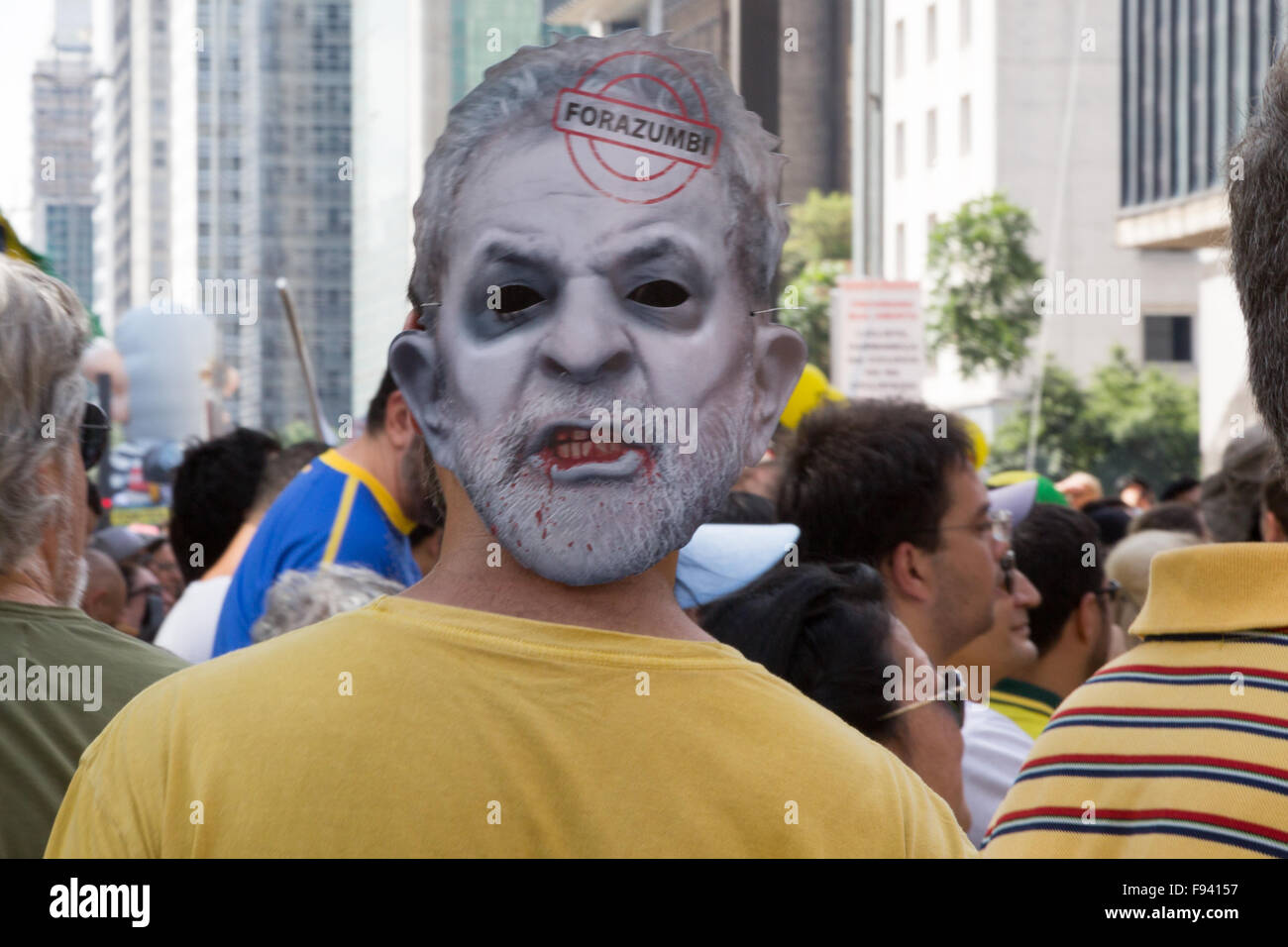 Sao Paulo, Brazil. 13th December, 2015. Demonstrator wears a mask depicting Brazil's former president Luiz Inacio Lula da Silva and a text written in Portuguese 'Fora Zumbi' (in English 'Out Zombie') is seen during a demonstration calling for the impeachment of Brazil's President Dilma Rousseff in Paulista avenue, Sao Paulo, Brazil. Credit: Andre M. Chang/Alamy Live News Stock Photo