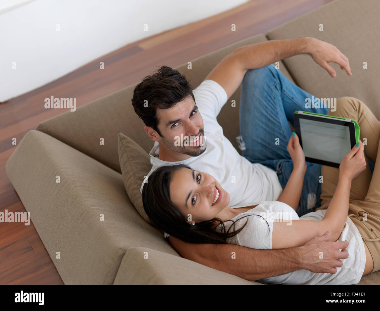 cheerful happy young couple making selfie together at home Stock Photo ...