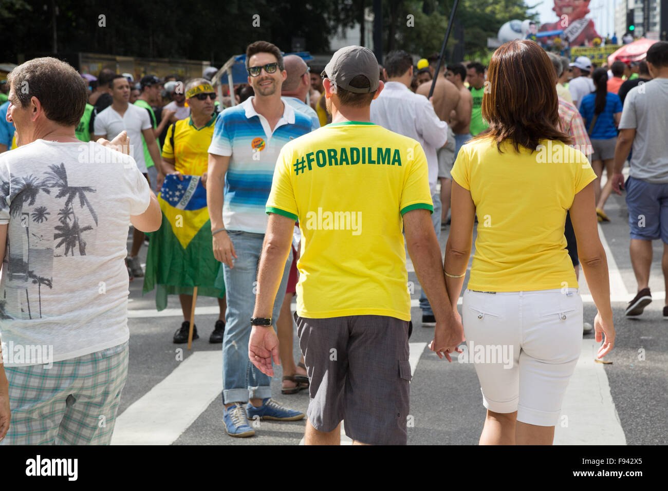 Sao Paulo, Brazil. 13th December, 2015. Demonstrator wears a t-shirt written in Portuguese 'Fora Dilma' (in English 'Out Dilma') during a demonstration calling for the impeachment of Brazil's President Dilma Rousseff in Paulista avenue, Sao Paulo, Brazil. Credit: Andre M. Chang/Alamy Live News Stock Photo