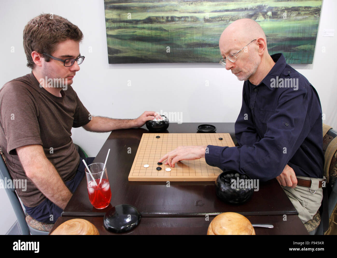 Two men playig go, strategic board game, Stock Photo