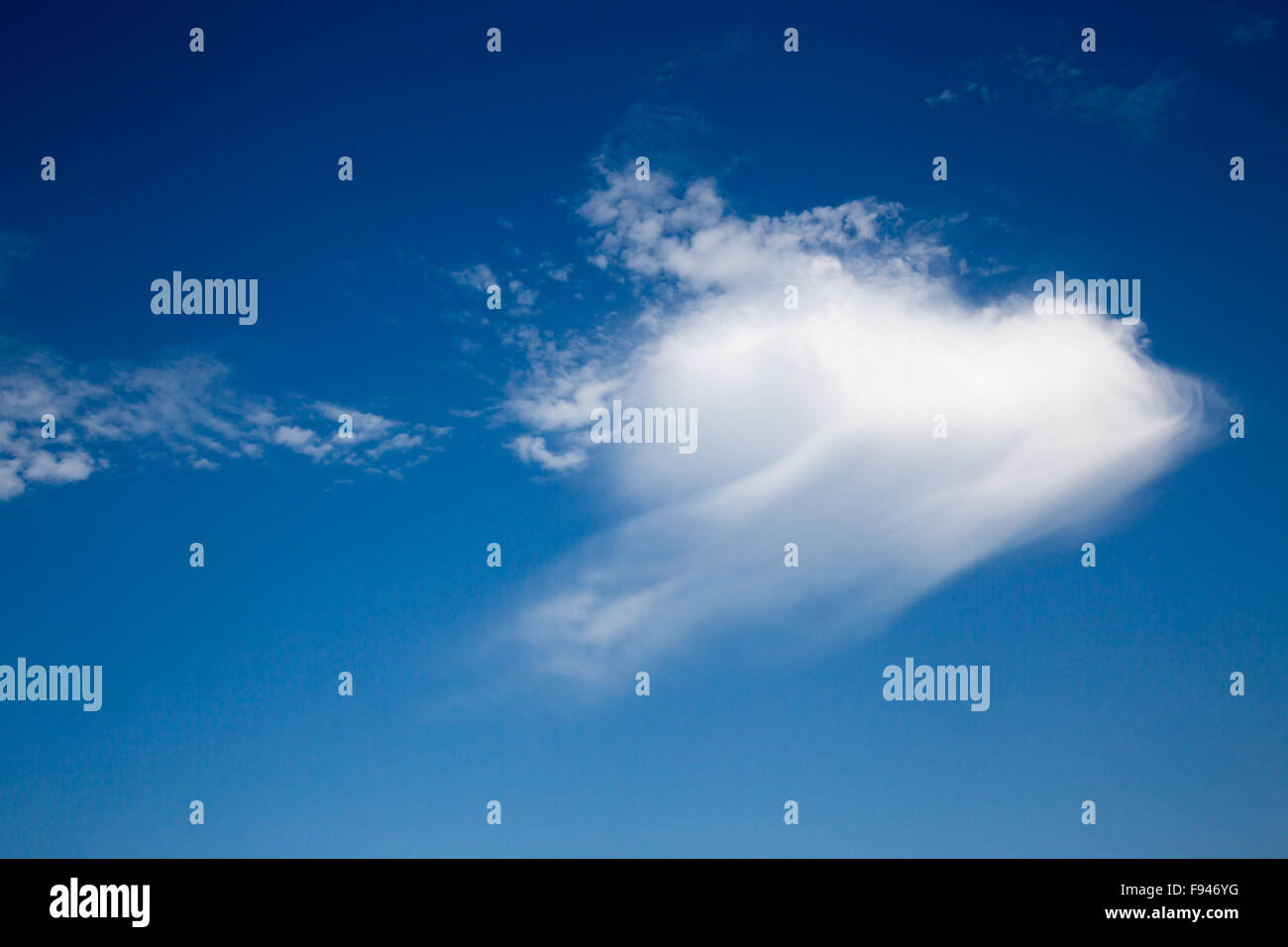 Blue sky with arrow cloud on a sunny day Stock Photo