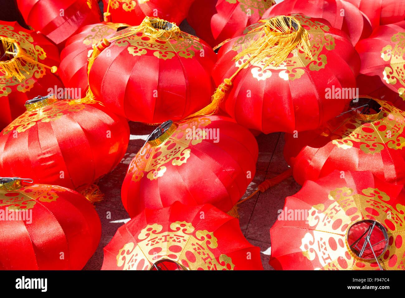 Pile of red chinese lantern on the floor in sunlight Stock Photo