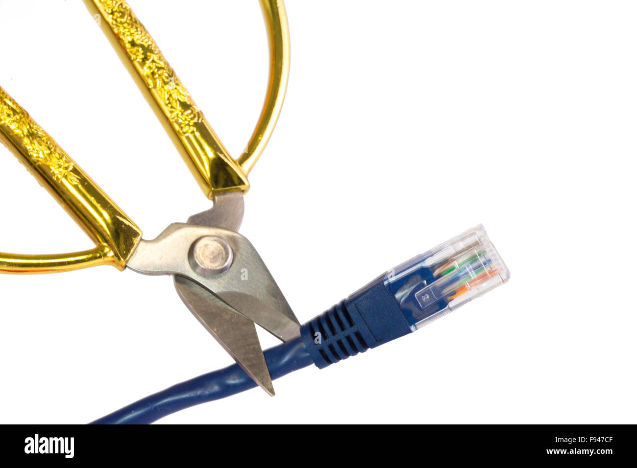 Blue network cable cut by golden scissors Stock Photo