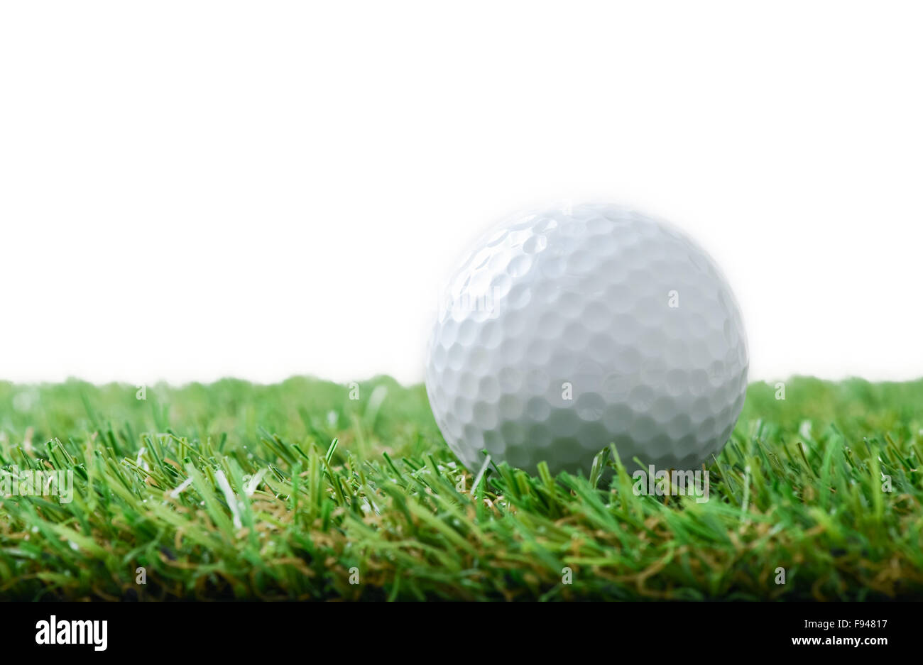 golf ball on green field Stock Photo Alamy