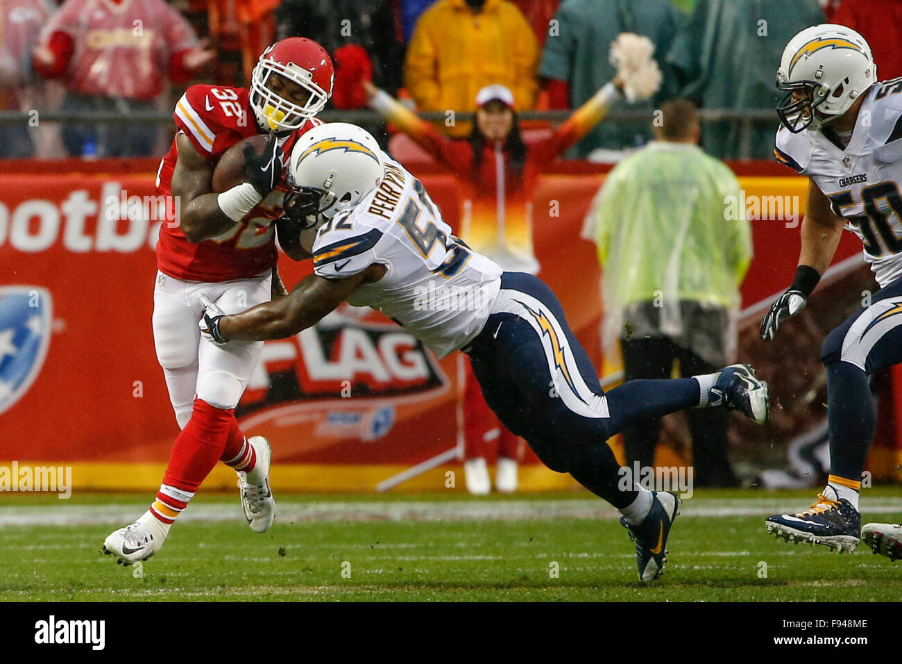 December 13, 2015: Kansas City Chiefs running back Spencer Ware (32) breaks a tackle by San Diego Chargers inside linebacker Denzel Perryman (52) during the NFL game between the San Diego Chargers and the Kansas City Chiefs at Arrowhead Stadium in Kansas City, MO Tim Warner/CSM. Stock Photo