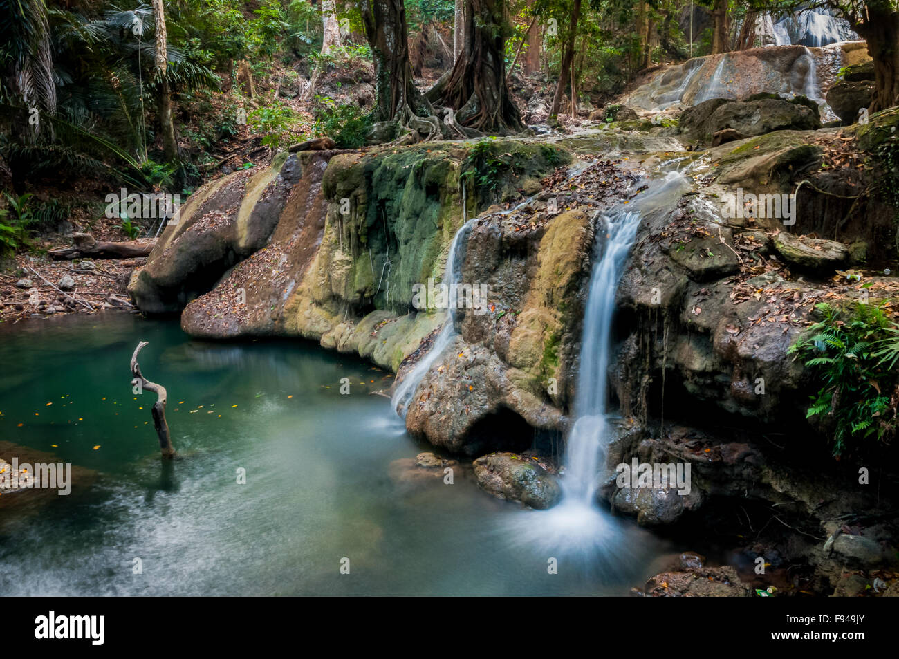 Waterfalls surrounded by forest in Oenesu near Kupang, East Nusa Tenggara, Indonesia. Stock Photo