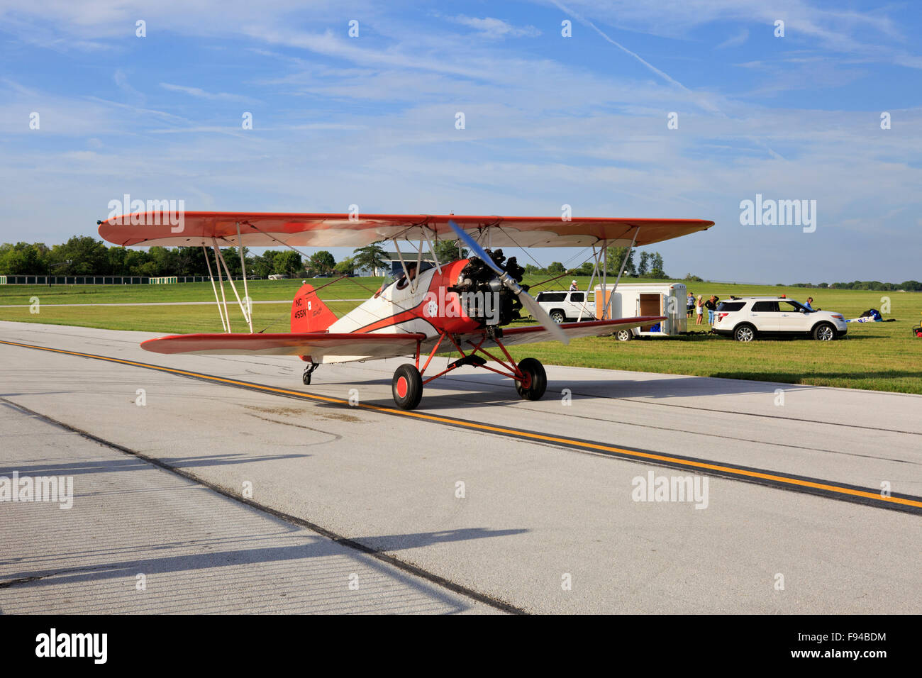 Curtiss-Wright Travel Air 4000 biplane taxiing on a runway. Stock Photo