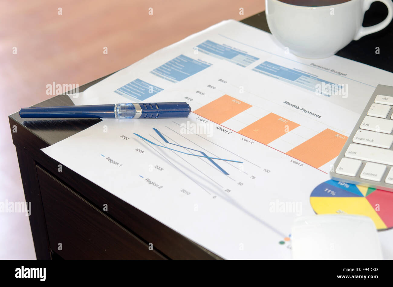 Keyboard Graph graphs and keyboard on the desk Stock Photo - Alamy