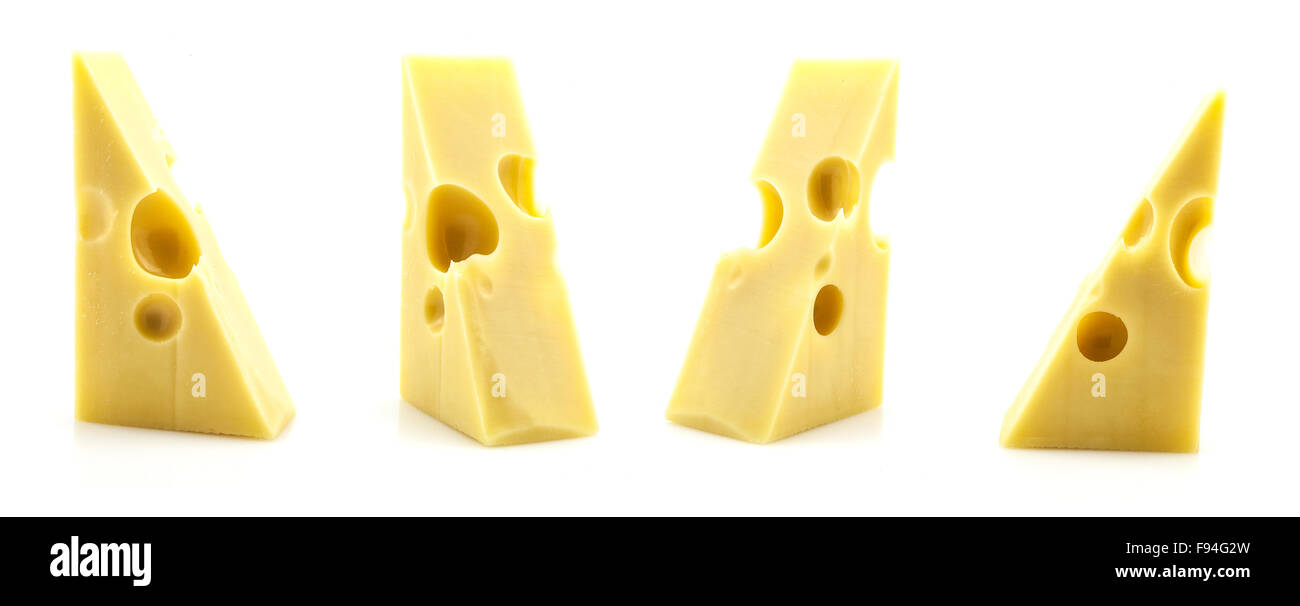 Various pieces of Emmental cheese with holes on a white background. Stock Photo