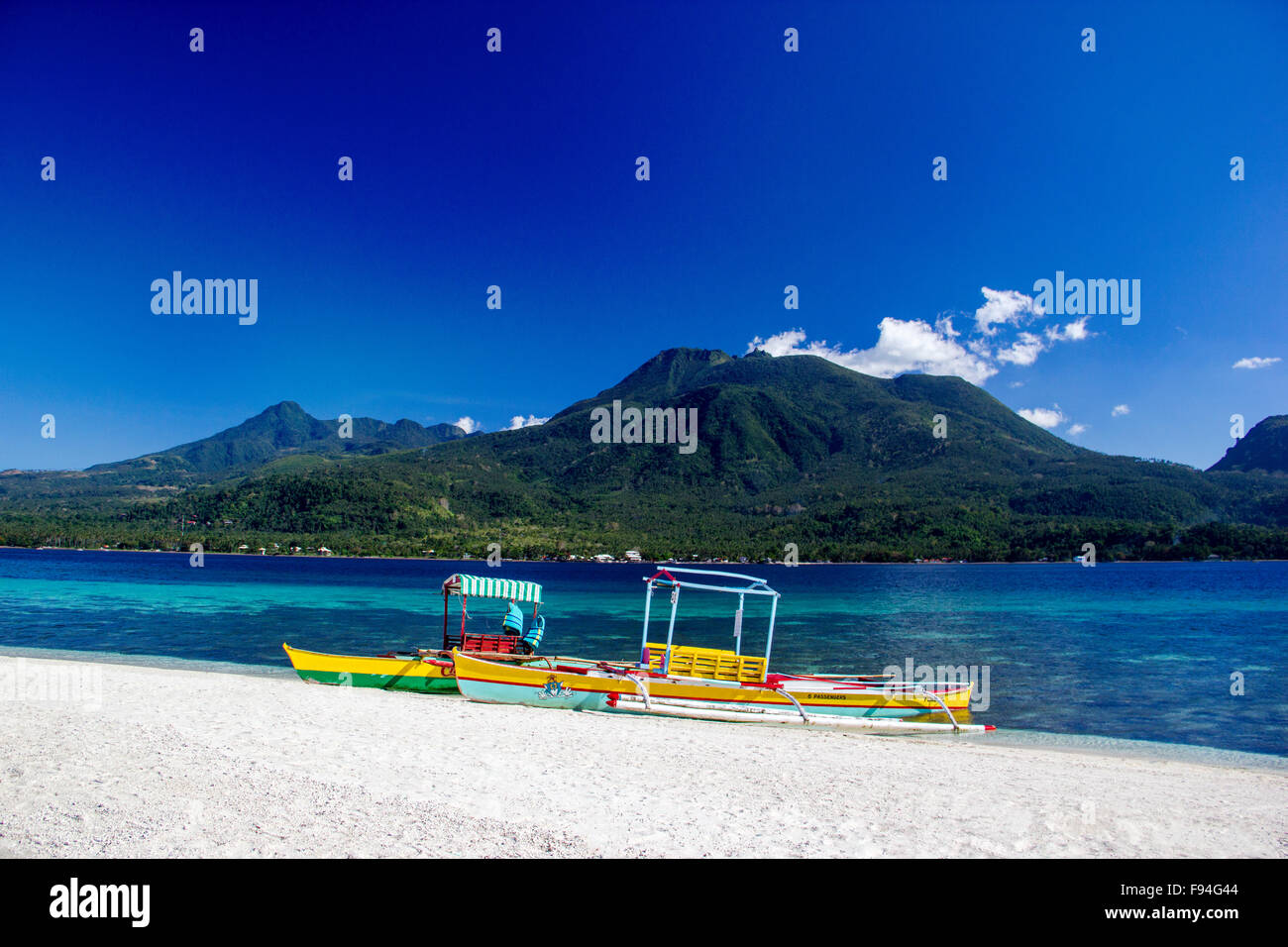 Boats on the white beach of tropical island Stock Photo