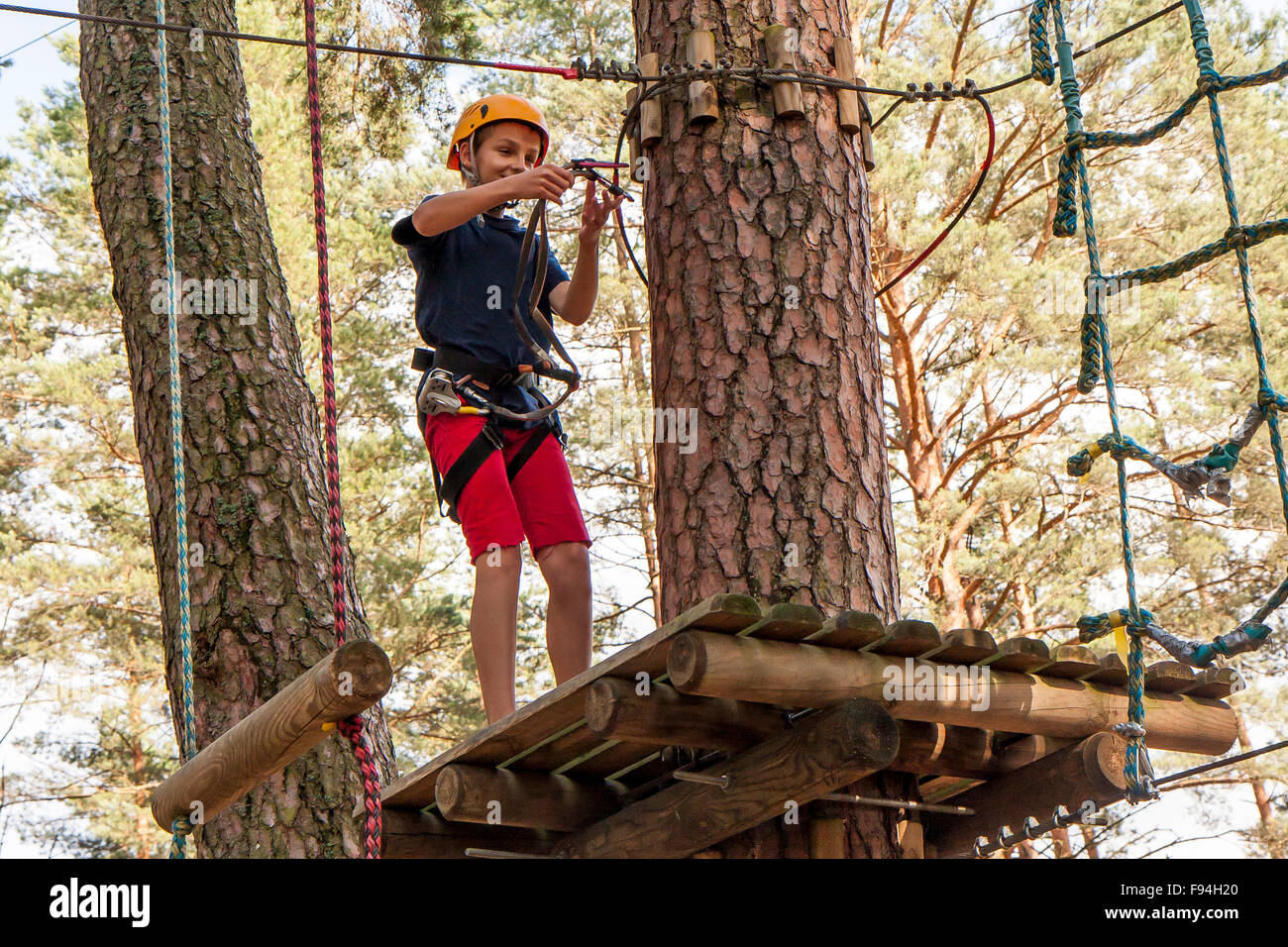 Boy wearing safety harness helmet hi-res stock photography and images ...