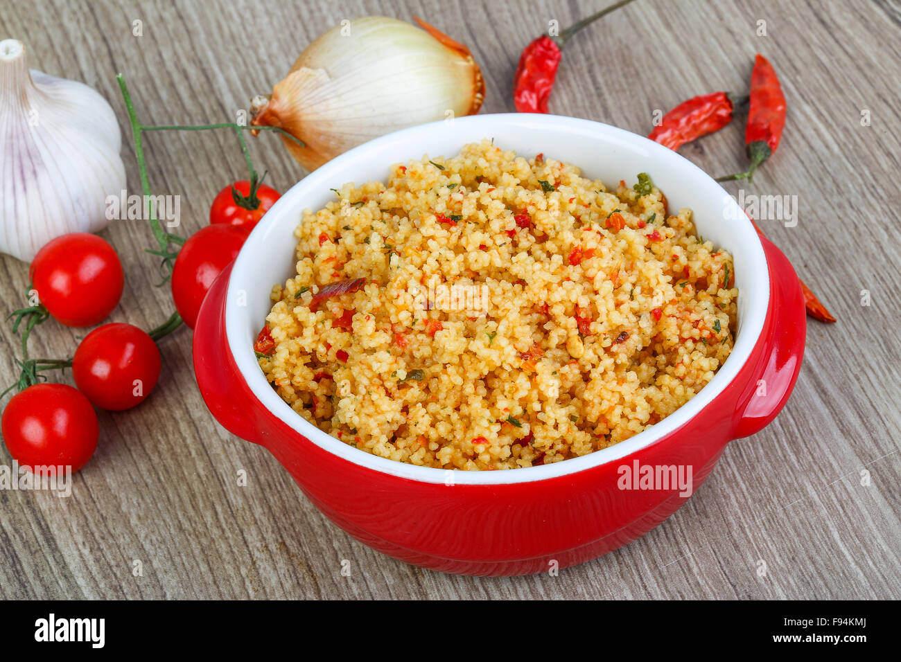 Arabic traditional cuisine Couscous with tomato and green onion Stock