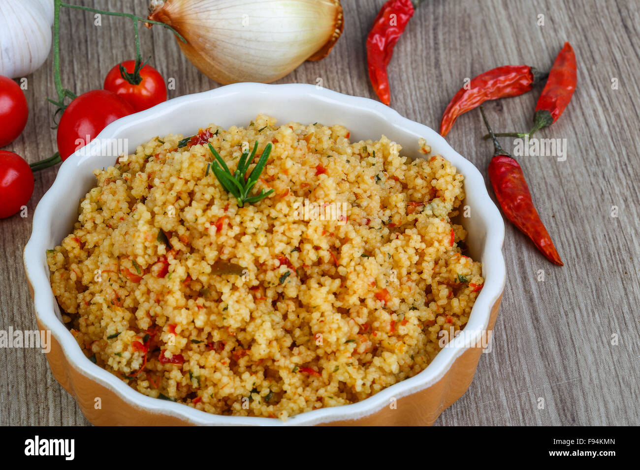 Arabic traditional cuisine Couscous with tomato and green onion Stock