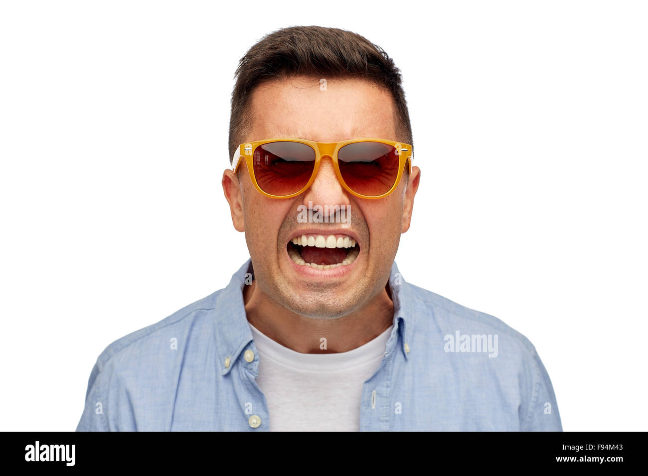 face of angry man in shirt and sunglasses Stock Photo