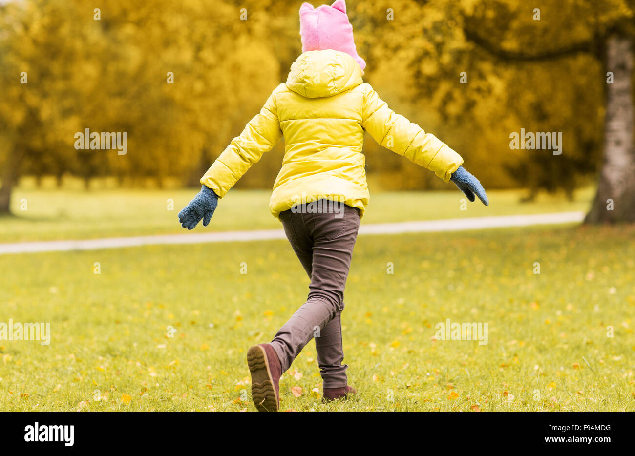 happy little girl running in autumn park Stock Photo - Alamy