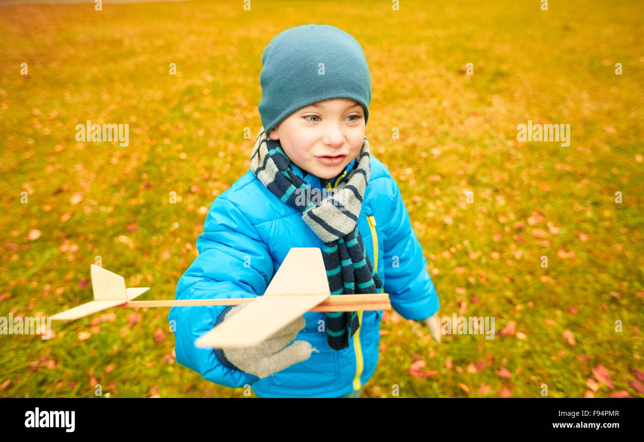 happy little boy playing with toy plane outdoors Stock Photo - Alamy