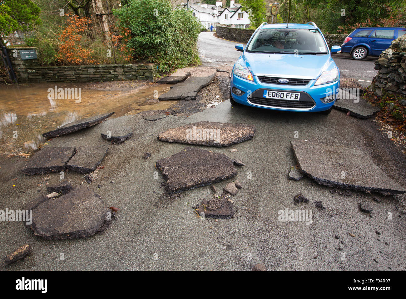 Tarmac ripped off the road in ambleside by the floods from Storm