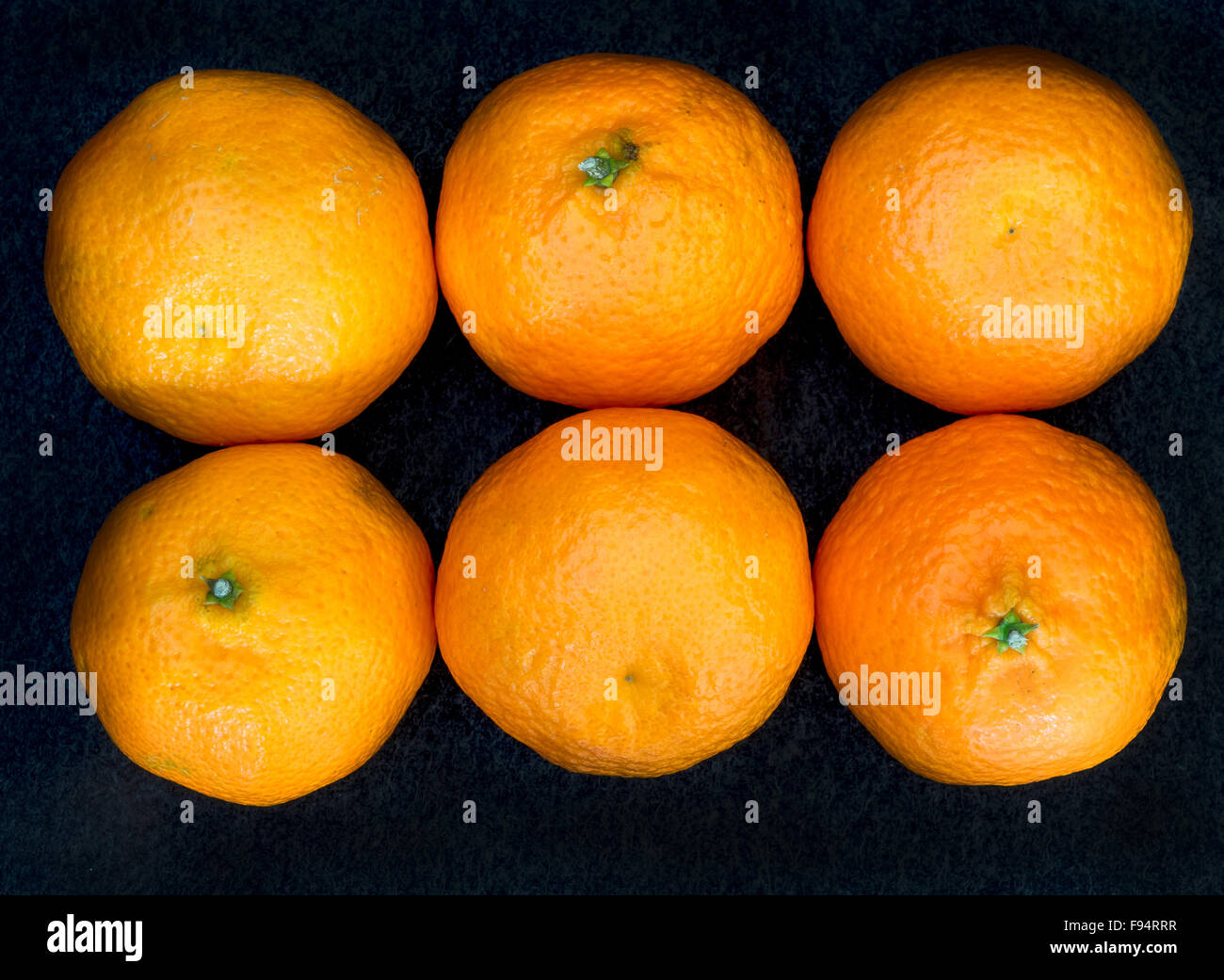 Six ripe clementines in rows Stock Photo Alamy