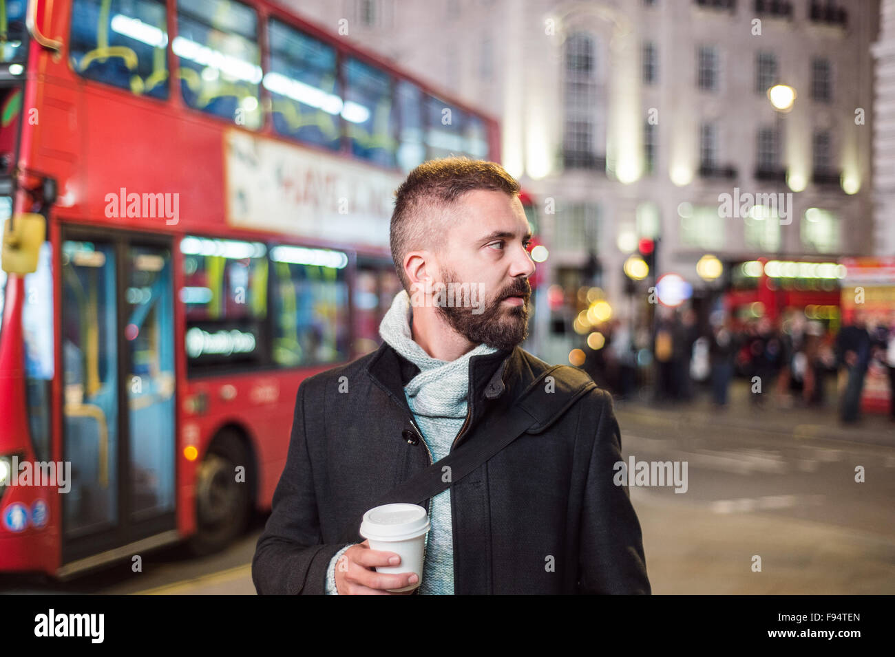 Young handsome man with coffee cup in London city Stock Photo