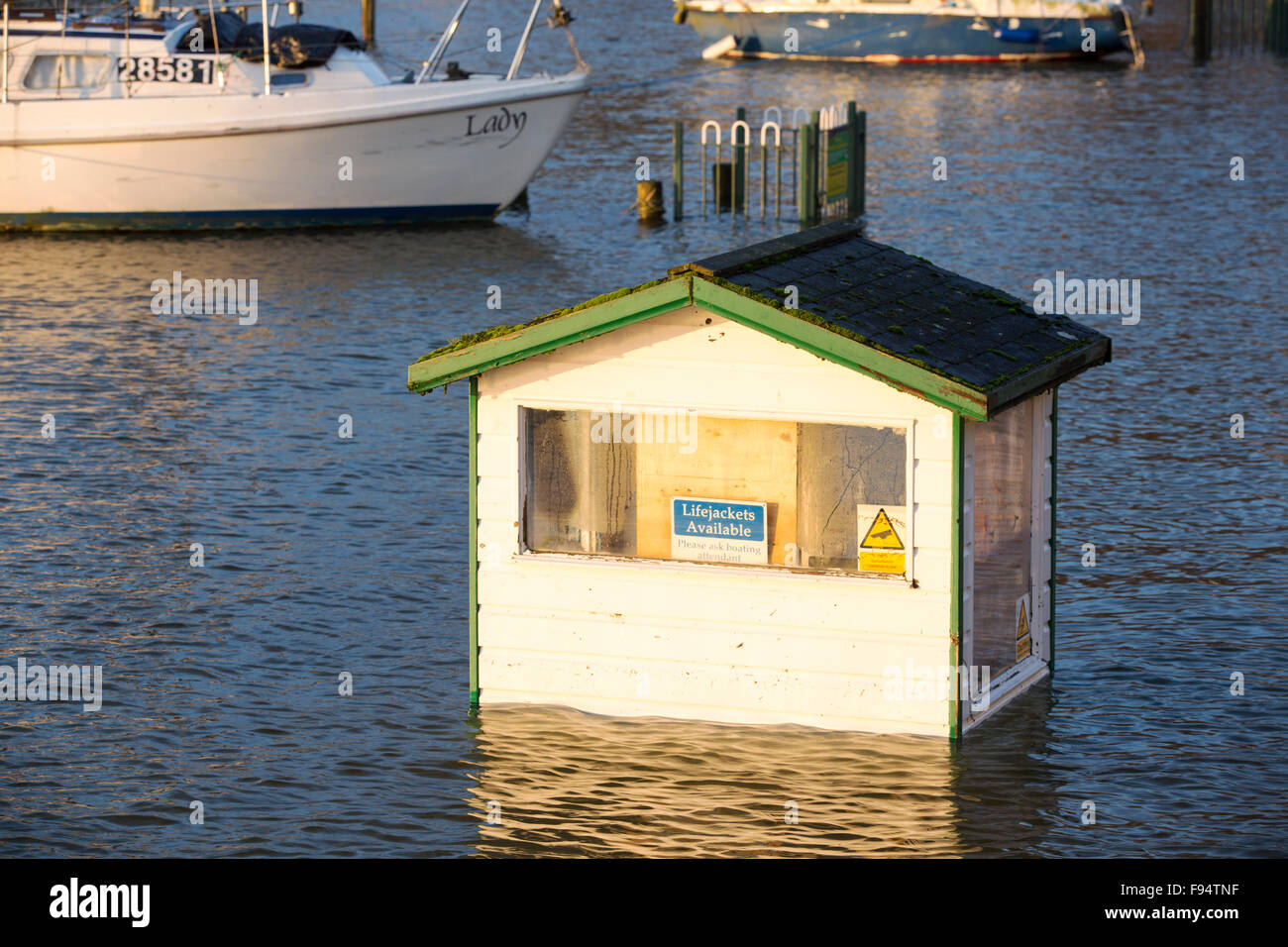 A boat hire cabin and the Wateredge Inn surrounded by flood water after Lake Windermere burst its banks in Ambleside in the Lake District on Monday 7th December 2015, after torrential rain from storm Desmond. Stock Photo