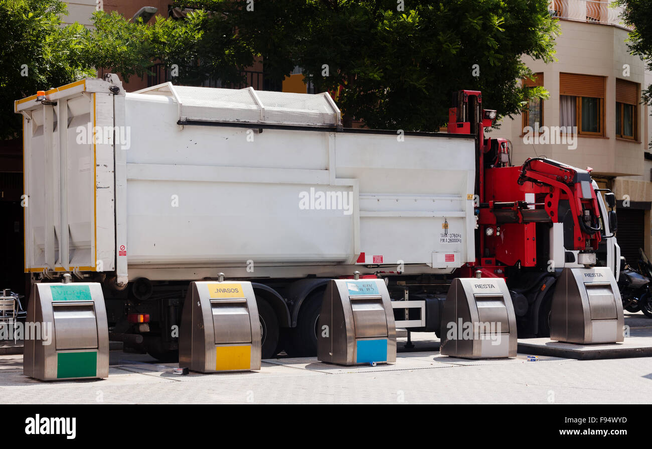 Recycling truck picking up bin at city street Stock Photo Alamy