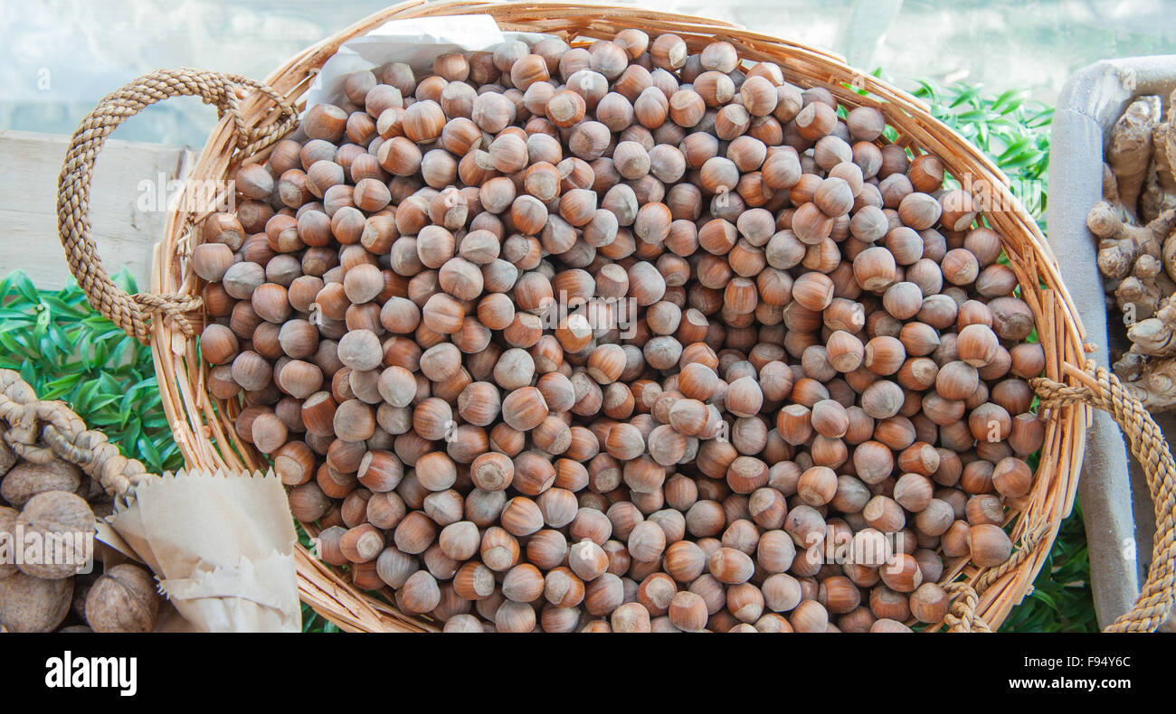 Basket with heap of whole hazelnuts on market shelf Stock Photo Alamy