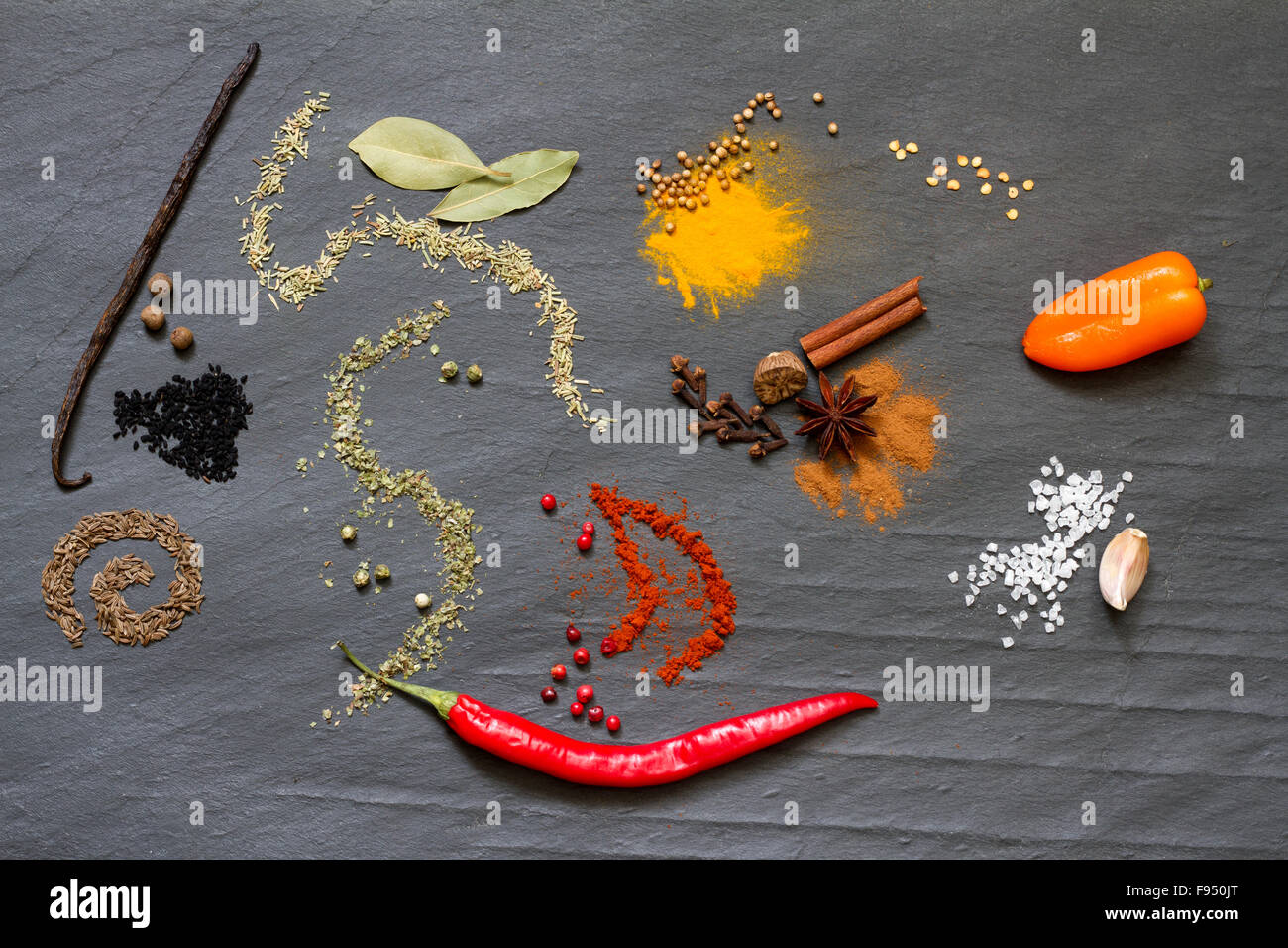 Spices and herbs on black marble abstract background concept Stock Photo