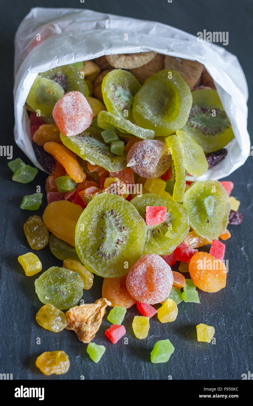 Candied dried mixed assortment of exotic fruits in the bag Stock Photo