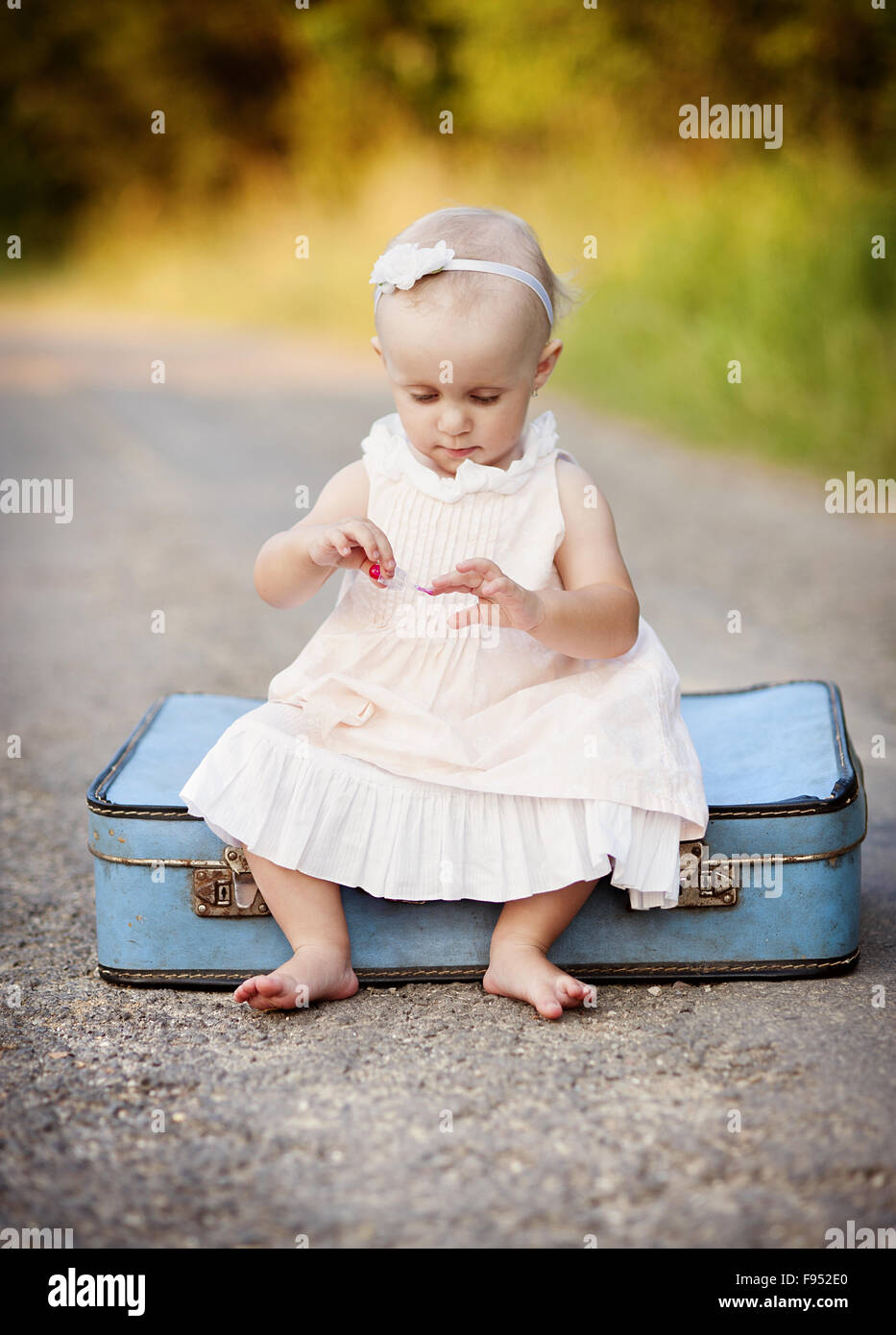 little girl with suitcase
