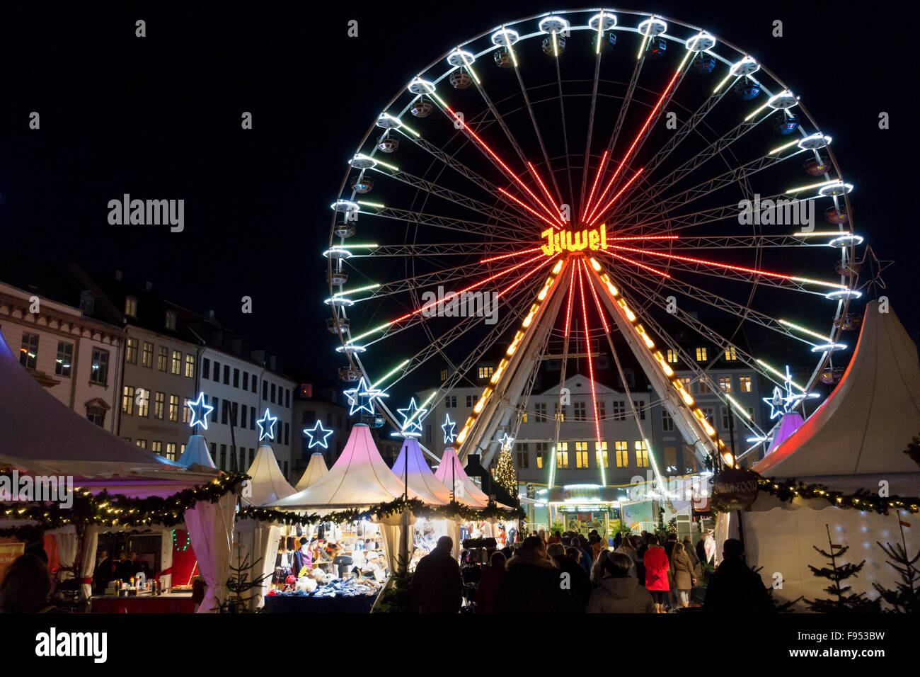 Ferris wheel, fun fair and gift and refreshment stalls at the new Christmas market in Nytorv at Strøget in Copenhagen, Denmark. Stock Photo