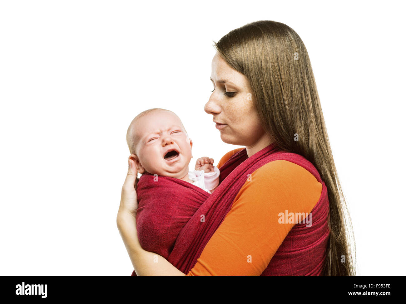 Crying child with mother isolated on white background in studio Stock Photo