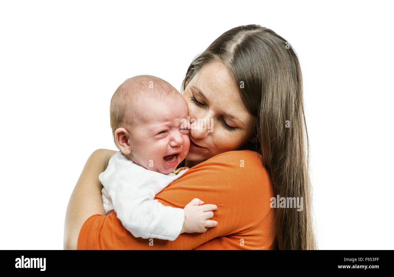 Crying child with mother isolated on white background in studio Stock Photo