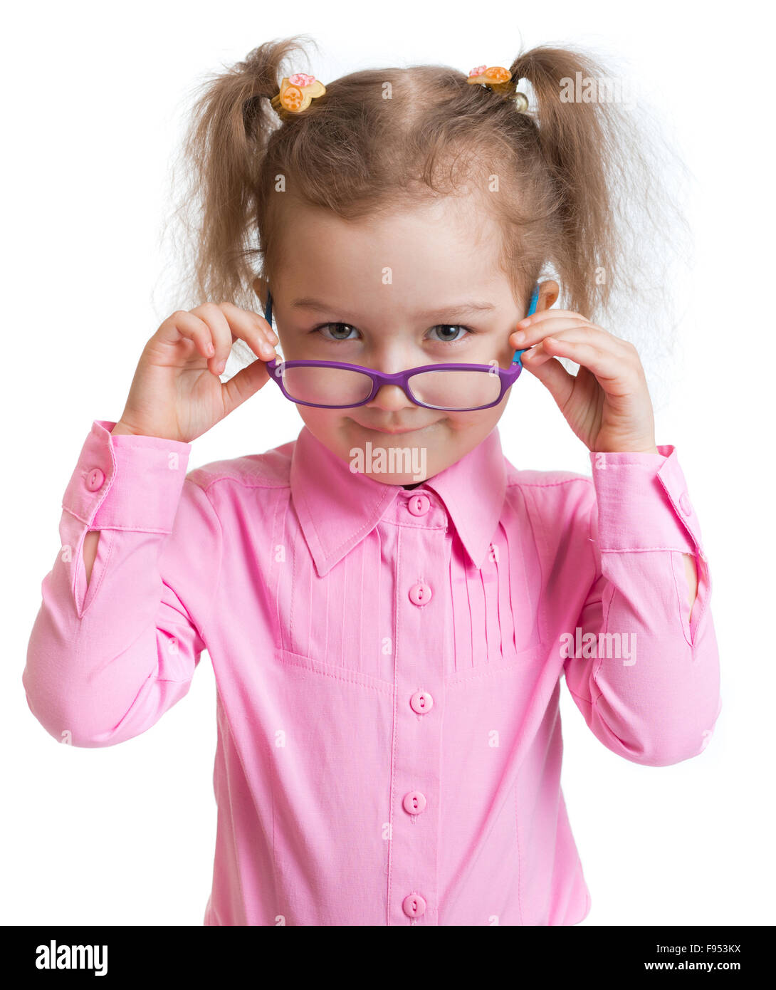 Funny kid putting on spectacles isolated Stock Photo