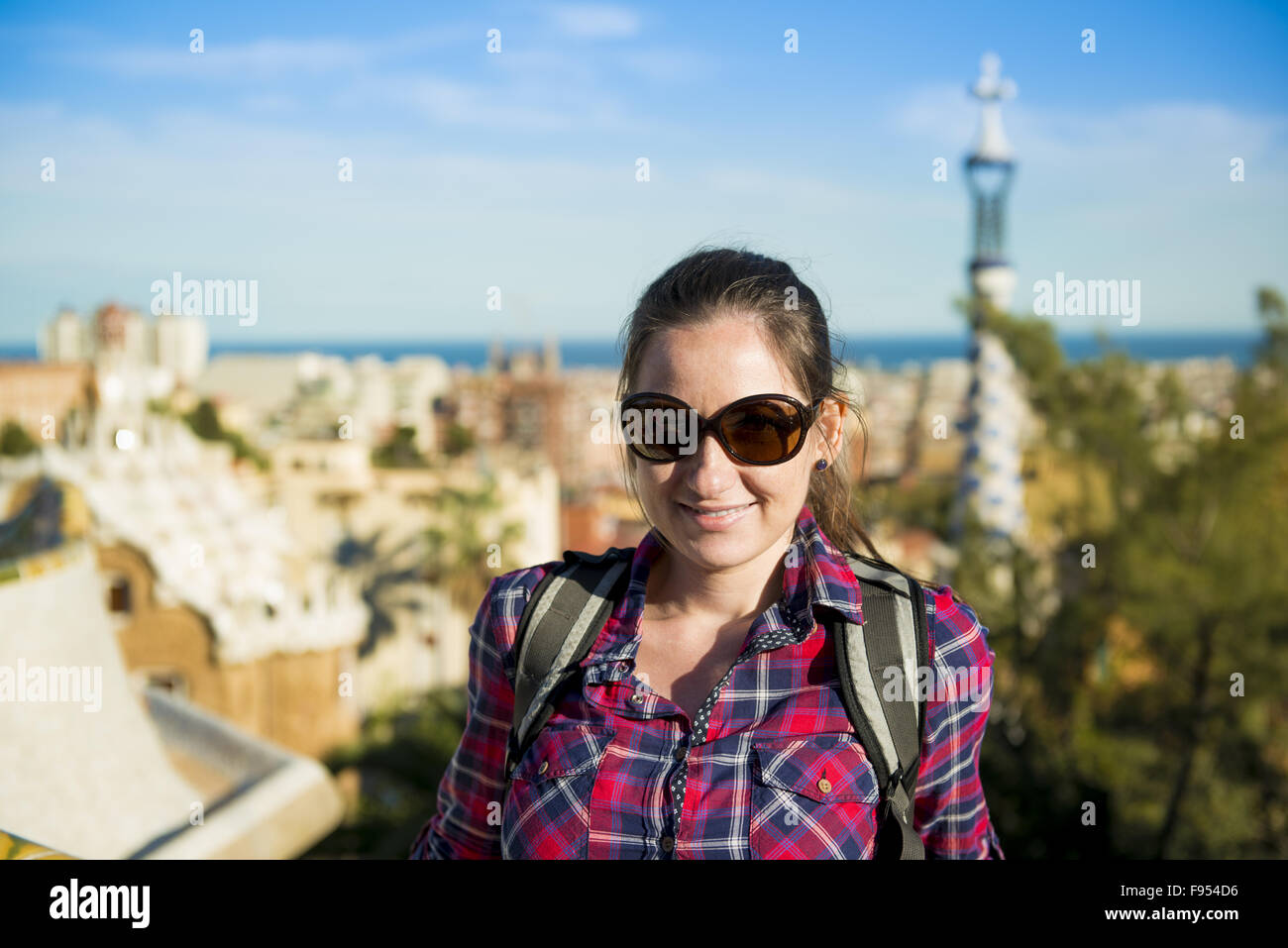Pretty young female tourist posing in Parc Guell in Barcelona, Spain. Stock Photo