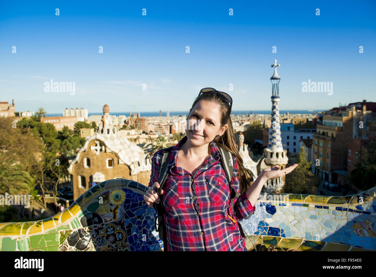 Pretty young female tourist posing in Parc Guell in Barcelona, Spain. Stock Photo