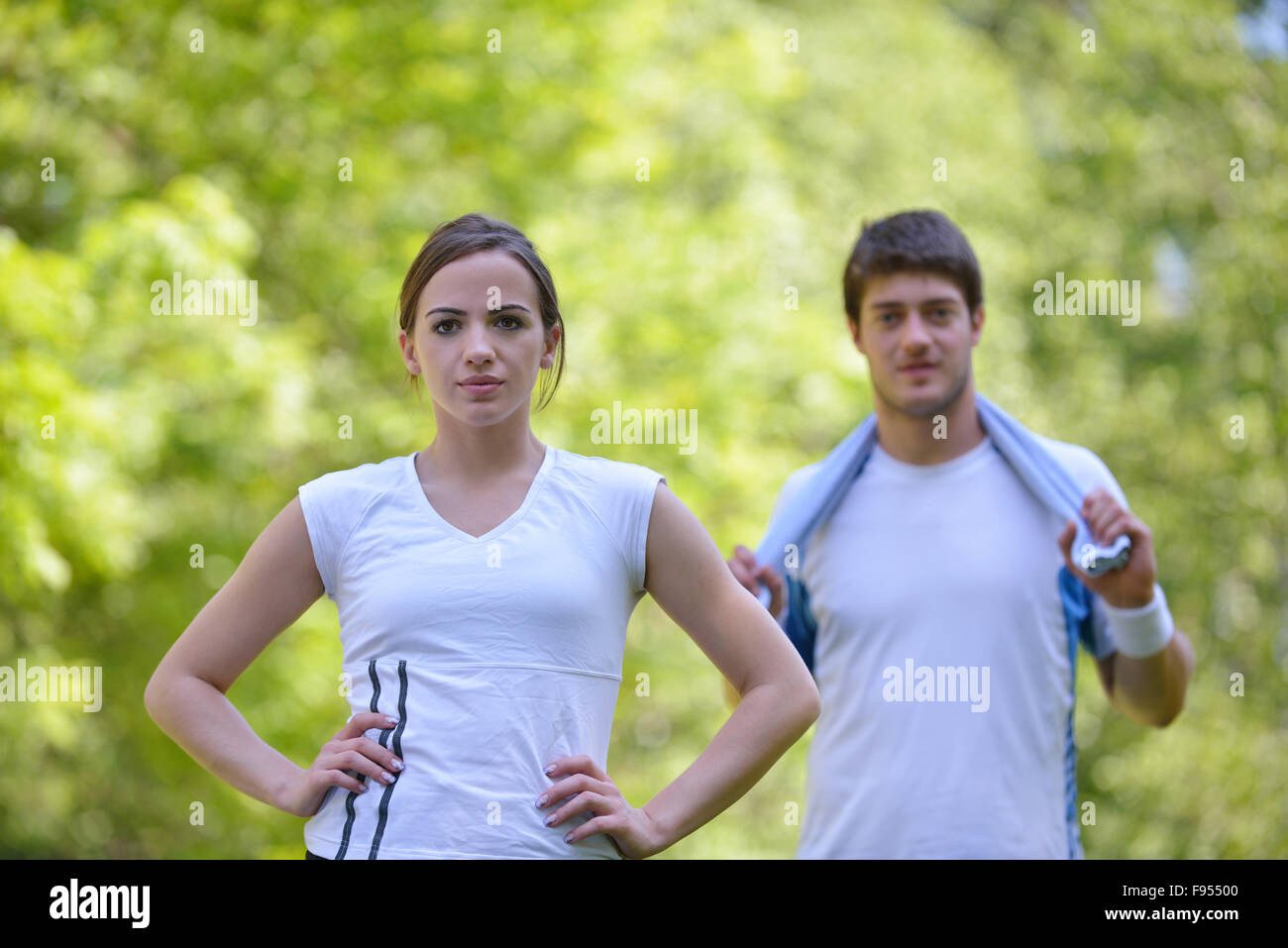 young health couple doing stretching exercise relaxing and warm up