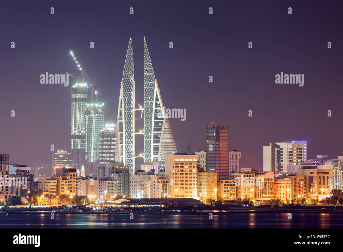 Skyline of Manama at night, Bahrain Stock Photo