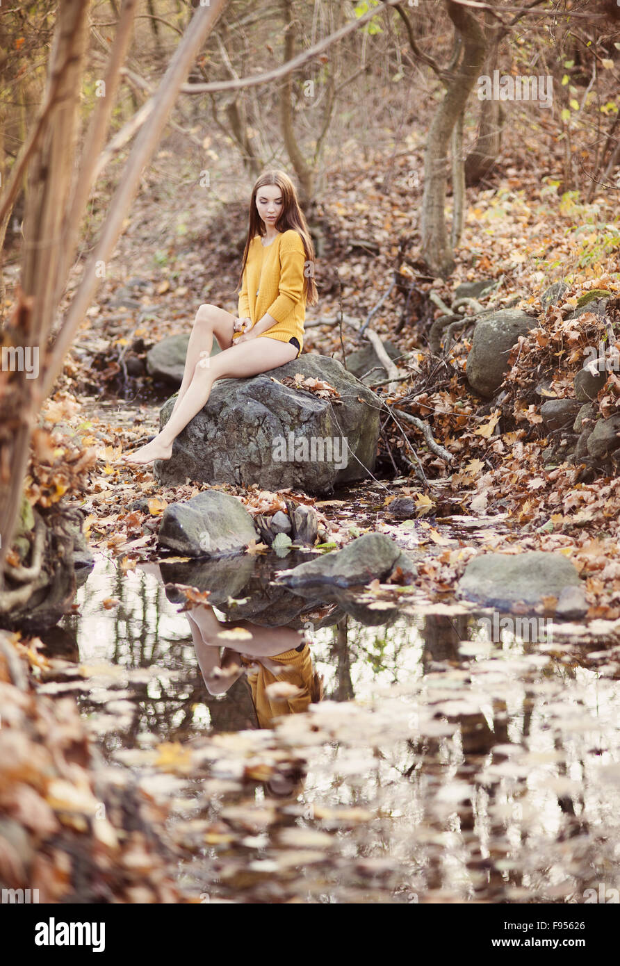 Outdoor portrait of beautiful girl in autumn forest Stock Photo - Alamy