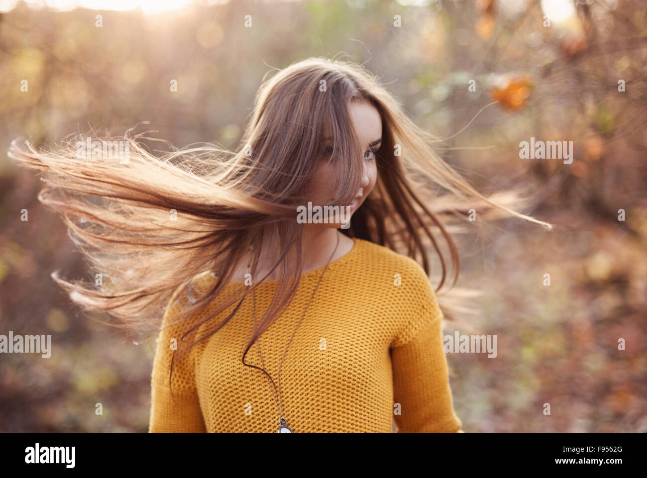 Outdoor portrait of beautiful girl in autumn forest Stock Photo - Alamy