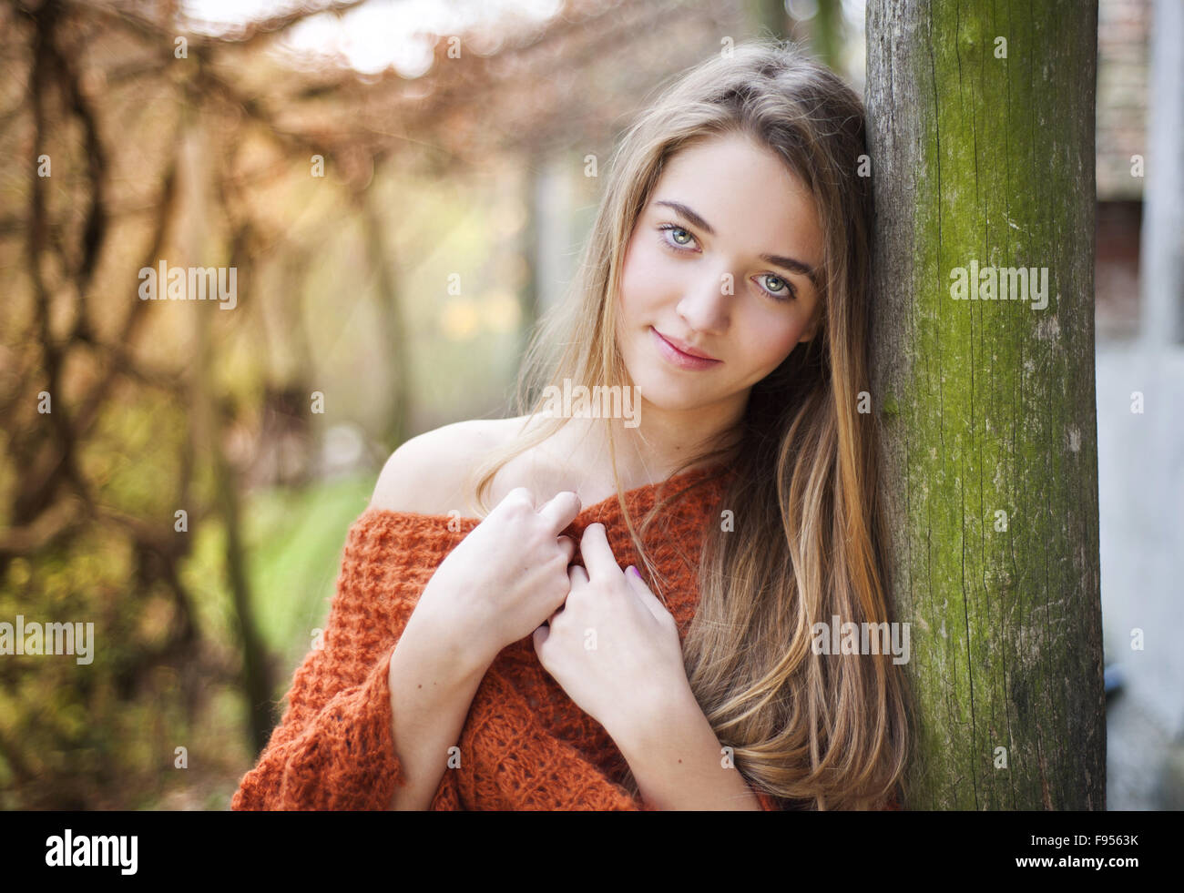 Outdoor portrait of beautiful girl in autumn forest Stock Photo - Alamy